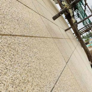 通化 黄金麻花岗岩荔枝面外墙干挂石材效果示例