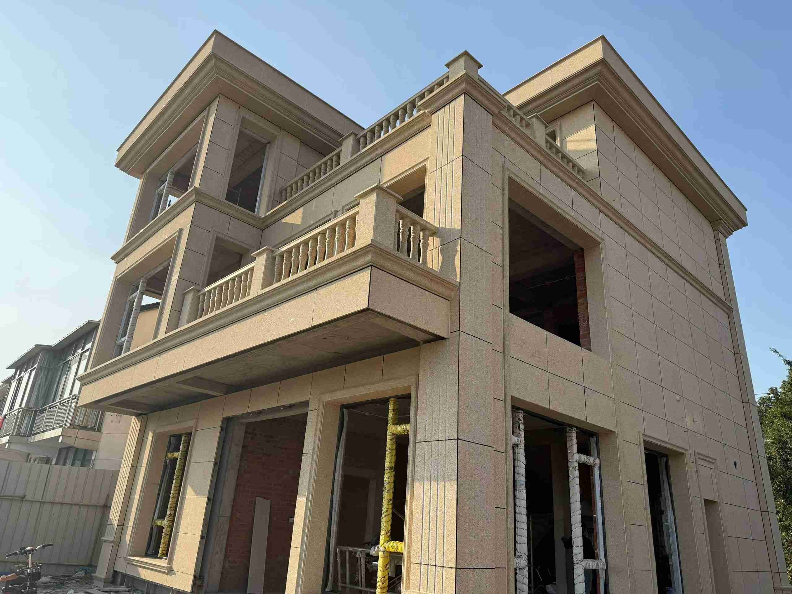 通化 黄金麻花岗岩石材荔枝面外墙干挂效果展示