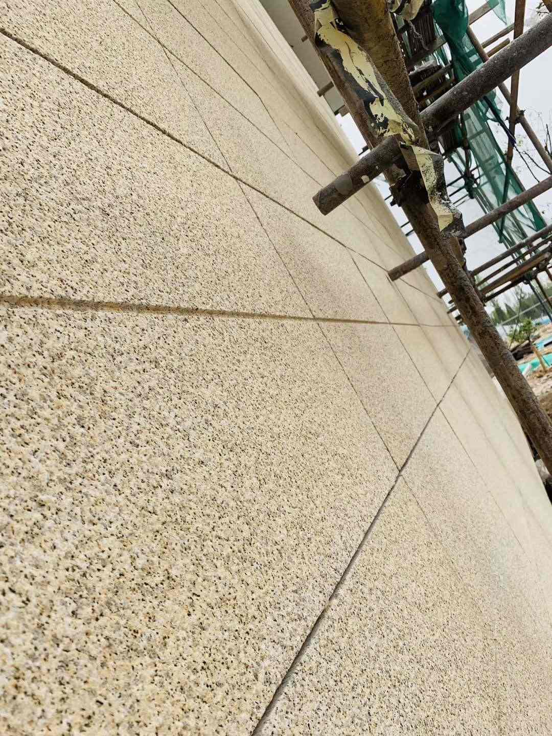 通化 黄金麻花岗岩荔枝面外墙干挂石材效果示例